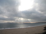 SX01099 Sunrays over island near Tenby.jpg